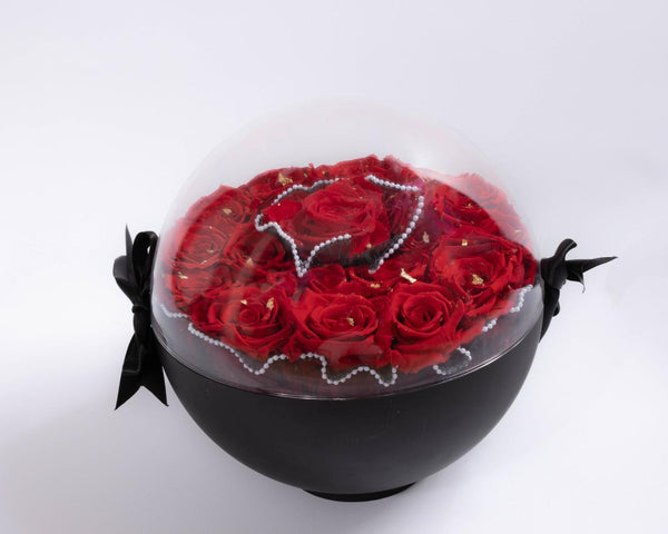 Black love capsule and gold leaves